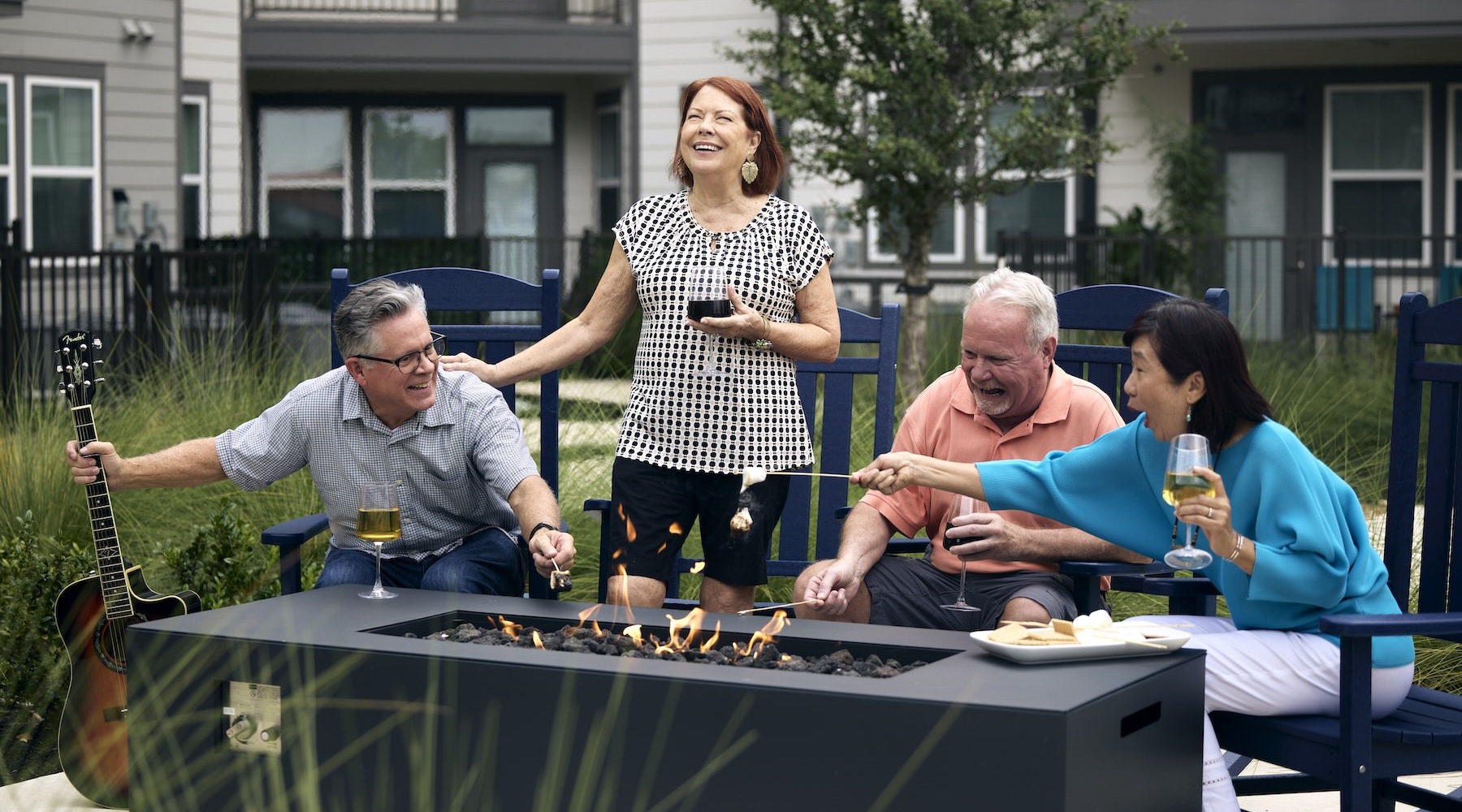 a group of people at a firepit